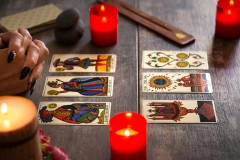 Fortune teller reading a future by tarot cards Stock Photos