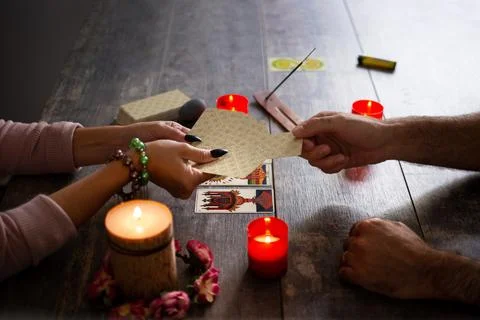 Fortune teller reading a future by tarot cards Stock Photos