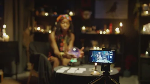 Fortune Teller Streaming Herself on Mobile Phone Stock Footage 247638550