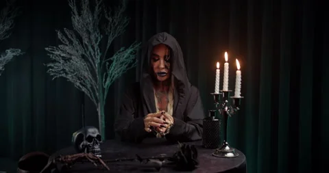 Fortune teller taking and shuffling tarot cards from table Stock Footage 319558945