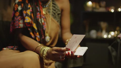 Fortune Teller Talking to Client about Her Destiny Using Tarot Cards Stock Footage 247628417