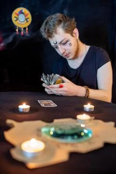 Fortune teller using tarot cards on black background Stock Photos
