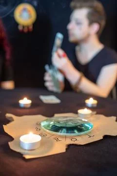 Fortune teller using tarot cards on black background Stock Photos