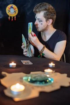 Fortune teller using tarot cards on black background Stock Photos