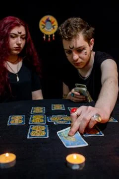 Fortune teller using tarot cards on black background Stock Photos