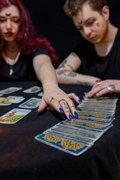 Fortune teller using tarot cards on black background Stock Photos