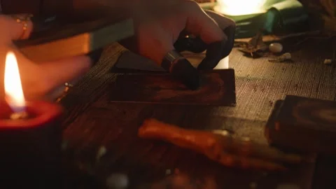 Fortune teller's hand dealing mysterious tarot cards for esoteric divination Stock Footage 318870326