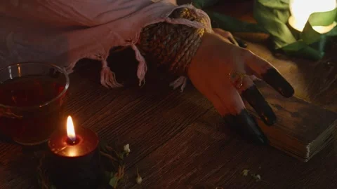 Fortune teller's hands performing divination, holding mysterious tarot cards Stock Footage 318868846