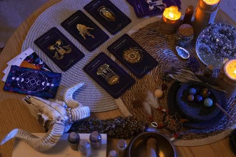 Fortune teller's tarot cards on table in dark room, top view Stock Photos