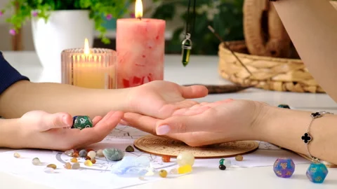 Fortune telling with a pendulum on the hand. Selective focus. Stock Footage 303979396