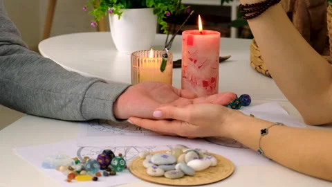 Fortune telling with a pendulum on the hand. Selective focus. Stock Footage 303980752