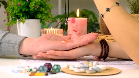 Fortune telling with a pendulum on the hand. Selective focus. Stock Footage 304534698