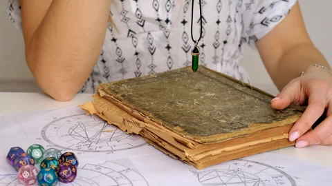 Fortune telling with a pendulum on the hand. Selective focus. Stock Footage 305983353