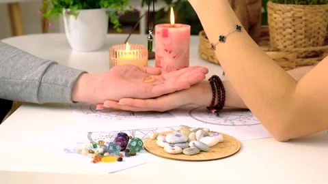 Fortune telling with a pendulum on the hand. Selective focus. Stock Footage 305983591