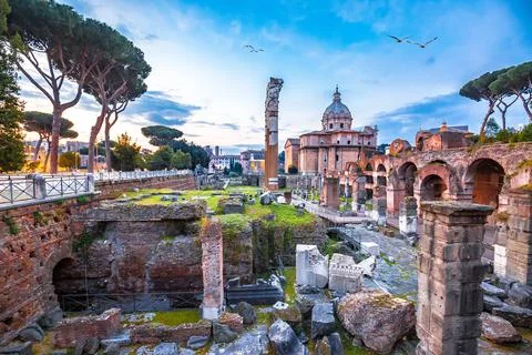 Forum Romanum or Roman Forum dawn colorful view, eternal city of Rome spectac Stock Photos