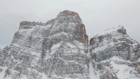 Forward Aerial Ascent Toward Snowy Monte Pelmo Cliffs Stock Footage 336983100