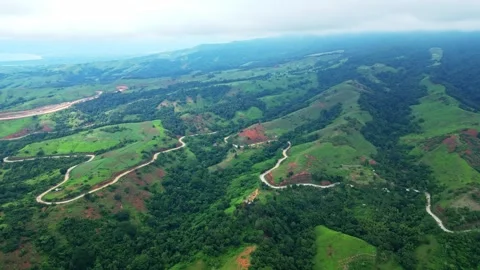 Forward aerial of the Bataanes in Bagac, Bataan, highlighting rolling green Stock Footage 321717434