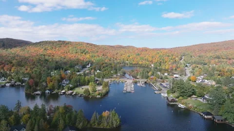 Forward Aerial Drone Flyover Toward Lakeside Community in Autumn Stock Footage 321376764