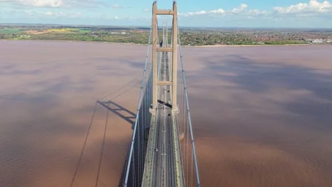 Forward aerial drone shot flying directly above traffic lanes on the Humber Stock Footage 345207696