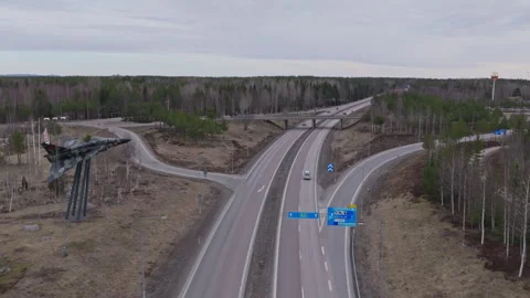 Forward aerial drone view of northbound motorway near Söderhamn, Sweden Видео 333692957