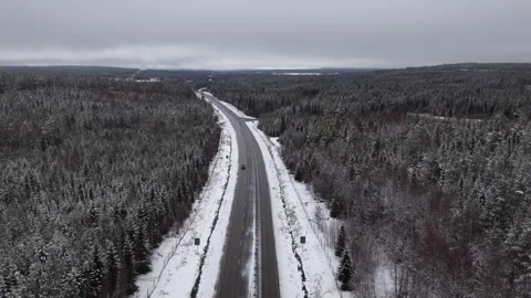 Forward aerial drone view of snowy motorway near Armsjön, Sweden Stock Footage 333683412