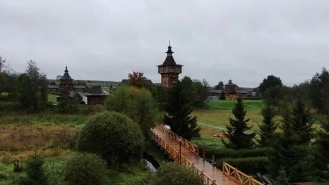 Forward aerial flight over wooden architecture Stock Footage 323974341