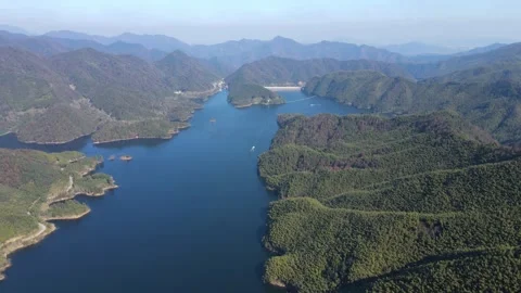 Forward Aerial Over Expansive Mountain Lake and Forest Anhui China Stock Footage 330457056