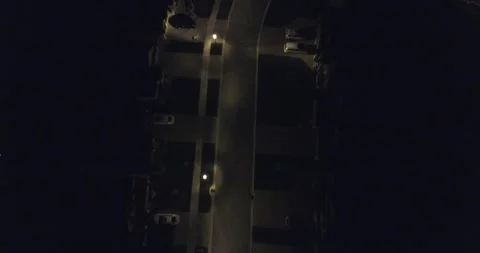Forward Aerial Over Homes Rooftops In Upscale Neighborhood At Night Stock-Footage 248072196