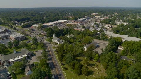 Forward Aerial Pan of a Small Town Amongst Trees in Smithtown Long Island Stock Footage 117440756