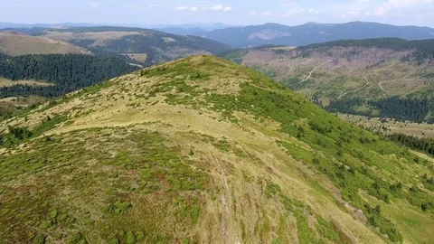 Forward aerial top view over mountain ridge Stock Footage 84948737