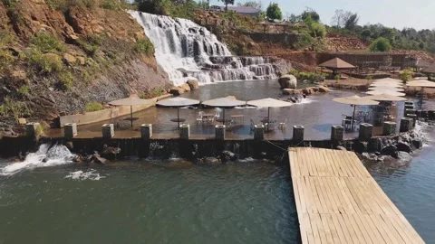 Forward aerial view across Tad Koo waterfall in Bolaven Plateau, Laos Stock Footage 248094881