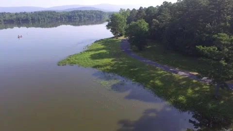 Forward aerial view over a beautiful lake in the mountains 動画素材 337204545