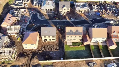Forward aerial view over a new housing estate under construction Stock Footage 340240591
