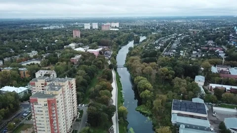 Forward aerial view over river and neighborhoods Stock Footage 324632968