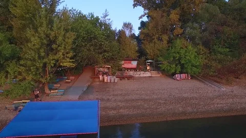 Forward aerial view over the riverside Stock Footage 70759240