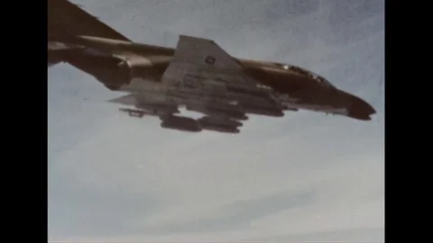 Forward air controllers drop a bomb on landscape during war - 1968 Stock Footage 99913138