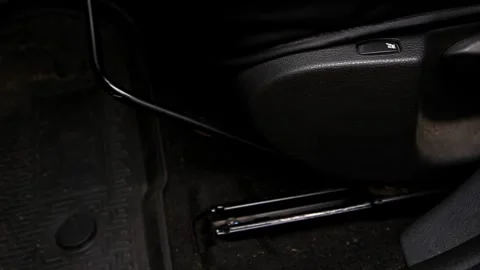 Forward and backward adjustment of the passenger seat, fuel filler cap release Stock Footage 329213971