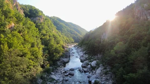 Forward Backlit Flight Over Rocky Arda Riverbed in the Rhodopes Stock Footage 321372736