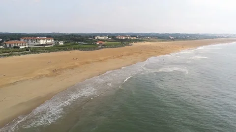 Forward camera movement over yellow sand beach and little waves of blue sea or Видео 108610669