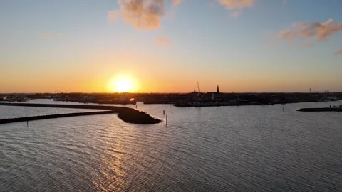 Forward dawn flight over quay toward harbor skyline Stock Footage 331841519