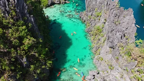 Forward descending drone into Big Lagoon revealing iconic karst paradise Palawan Vídeo Stock 327638116
