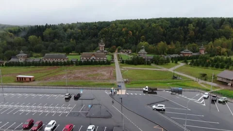 Forward descending drone flight along monastery path Vidéo 324755990