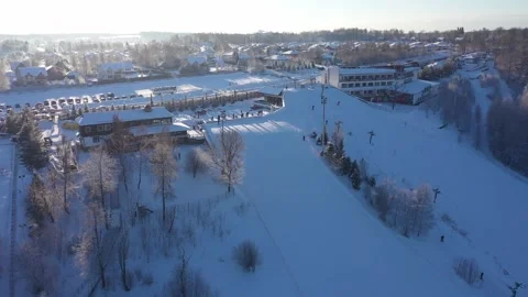 Forward descending drone view turning above snowy slope Stock Footage 322641506