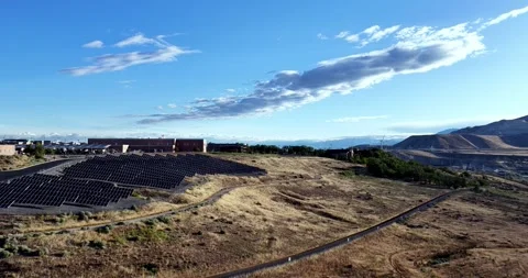 Forward drone approach of Solar Field Powering Camp Williams Army Base on a Stock-Footage 339047791