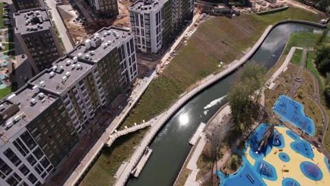 Forward drone descent above river and embankment Stock Footage 329576401