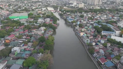 Forward Drone Flight Above Pasig River and Urban Manila Description: Stock Footage 335945207