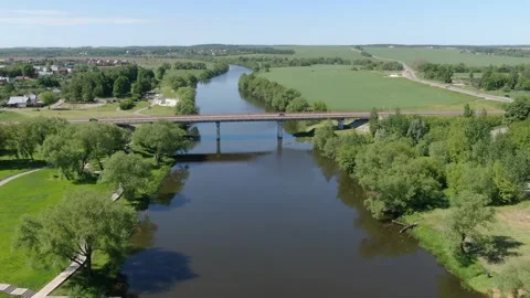 Forward drone flight along river and bridge Stock Footage 331829159