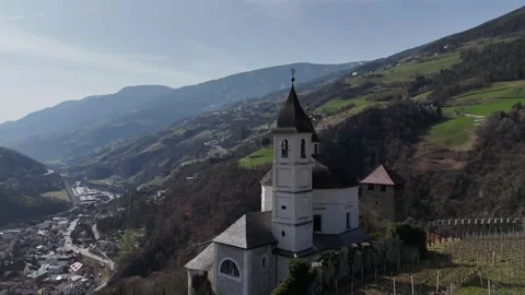 Forward Drone Flight Alongside Church Dome Over Vineyards in Chiusa, Sou Vídeo Stock 335621064