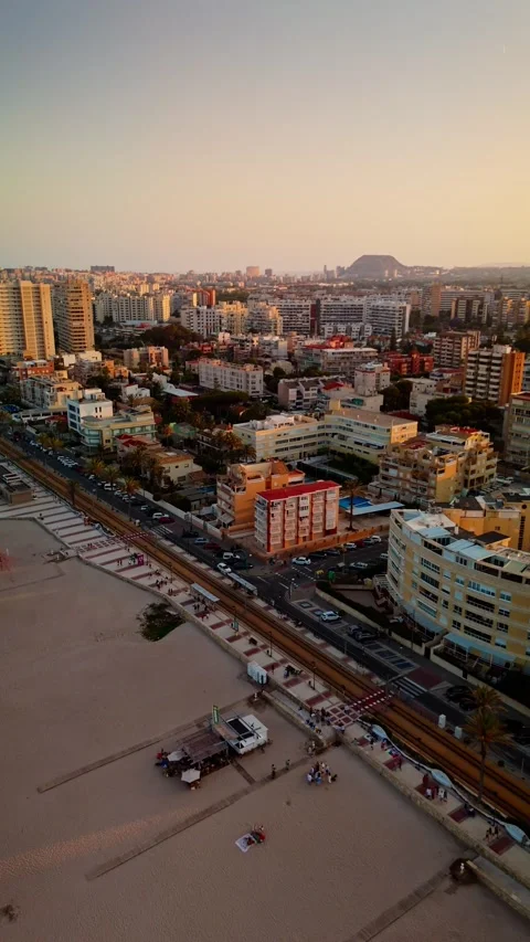 Forward drone flight over beach promenade and residential buildings Stock Footage 311065278