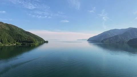Forward Drone Flight Over Calm Waters of Lake Biwa Japan Stock Footage 336406436